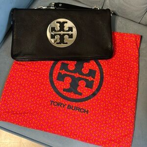 Black leather authentic “TORY BURCH” handbag with original satchel. Used once.